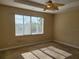 Bright bedroom with a large window allowing ample natural light at 6240 Miramonte Dr # 102, Orlando, FL 32835