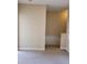 Hallway with neutral carpet and view of stairs leading to other level of the home at 6240 Miramonte Dr # 102, Orlando, FL 32835
