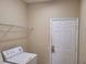 Laundry room featuring a washing machine and shelving at 6240 Miramonte Dr # 102, Orlando, FL 32835
