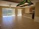 Open living space featuring tile floors and sliding glass doors leading to an outdoor area at 6240 Miramonte Dr # 102, Orlando, FL 32835