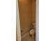 Compact powder room with a toilet and roll paper holder at 6240 Miramonte Dr # 102, Orlando, FL 32835