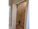 Unfinished attic storage space with white shelving at 6240 Miramonte Dr # 102, Orlando, FL 32835
