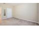 Bedroom featuring carpet, neutral walls and white trim at 6402 Cava Alta Dr # 107, Orlando, FL 32835