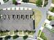 Bird's-eye view of residential complex showcasing rooflines, private patios, and organized parking areas at 6524 Calamondin Dr, Winter Garden, FL 34787