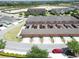 Aerial view showcasing townhome exteriors, driveways, and community layout at 6524 Calamondin Dr, Winter Garden, FL 34787