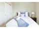 Cozy bedroom features a comfortable bed with accent pillows and closet at 6524 Calamondin Dr, Winter Garden, FL 34787