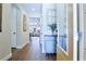 Entryway featuring hardwood floors, a decorative cabinet, and an open view into the living room at 6524 Calamondin Dr, Winter Garden, FL 34787