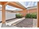 Inviting outdoor area showing covered walkway, storage, exterior door and trimmed landscaping at 6524 Calamondin Dr, Winter Garden, FL 34787