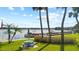 Waterfront backyard features a picnic table with a view of the lake and dock at 690 Osceola Ave # 502, Winter Park, FL 32789