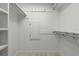 Well-organized closet with built-in shelving and hanging rods for storage at 690 Osceola Ave # 502, Winter Park, FL 32789