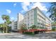 Modern mid-rise building, showcasing its well-maintained facade and ample parking at 690 Osceola Ave # 502, Winter Park, FL 32789