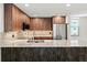 Bright, updated kitchen featuring wood cabinets, stainless steel appliances, and marble countertops at 690 Osceola Ave # 502, Winter Park, FL 32789