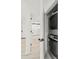 Bright laundry closet features stackable washer and dryer for convenient in-home laundry at 690 Osceola Ave # 502, Winter Park, FL 32789