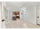 Open-concept living space with updated kitchen featuring modern finishes and luxury vinyl plank flooring at 690 Osceola Ave # 502, Winter Park, FL 32789