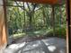 A screened in lanai with beautiful, private views of lush green trees at 7089 Balboa Dr # 7089, Orlando, FL 32818