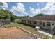 Spacious backyard with a shed, green lawn, and a patio area, great for outdoor activities at 735 Oak Ter, Orange City, FL 32763