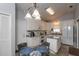 Bright kitchen with white cabinets, stainless steel appliances, and an island at 735 Oak Ter, Orange City, FL 32763