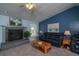 Comfortable living room with a fireplace, plush seating, and bright windows offering plenty of natural light at 735 Oak Ter, Orange City, FL 32763