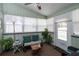 Cozy sun room filled with natural light, comfortable seating, and charming decor at 735 Oak Ter, Orange City, FL 32763