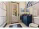 Powder bathroom featuring a custom vanity, tile accents, and pool views at 8590 Apache Trl, Kissimmee, FL 34747