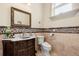 Charming bathroom with a marble countertop, decorative tiles, and a classic design, perfect for everyday comfort and style at 8590 Apache Trl, Kissimmee, FL 34747