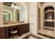 Stylish bathroom vanity with granite countertops and abundant storage, complemented by marble flooring and elegant fixtures at 8590 Apache Trl, Kissimmee, FL 34747