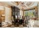 Formal dining room with a large table, ornate ceiling, and checkered floors creates an elegant space at 8590 Apache Trl, Kissimmee, FL 34747