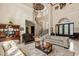 Grand foyer with staircase, chandelier, and elegant furnishings offers a luxurious welcome at 8590 Apache Trl, Kissimmee, FL 34747