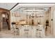 Gourmet kitchen features custom cabinetry, a large center island, and high-end appliances for the home chef at 8590 Apache Trl, Kissimmee, FL 34747