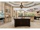 Spacious kitchen with custom cabinets, granite countertops, and large island with sink at 8590 Apache Trl, Kissimmee, FL 34747