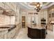 Spacious kitchen with granite countertops, a center island, and stainless steel appliances is great for cooking at 8590 Apache Trl, Kissimmee, FL 34747