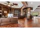 Luxury home office with custom millwork, hardwood floors, a wet bar, and access to an outdoor living area at 8590 Apache Trl, Kissimmee, FL 34747