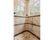Tiled shower featuring multiple showerheads and body sprays, creating a spa-like experience in the comfort of home at 8590 Apache Trl, Kissimmee, FL 34747