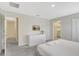 Clean bedroom with a TV and two entryways at 8969 Stinger Dr, Davenport, FL 33896