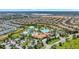 A vibrant aerial view showcases the community pool nestled among lush landscaping and single-Gathering homes at 8969 Stinger Dr, Davenport, FL 33896