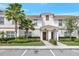 Townhouse exterior featuring well-maintained landscaping and a welcoming entrance at 8969 Stinger Dr, Davenport, FL 33896