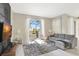 Cozy living room with sliding glass doors to the outdoor pool area at 8969 Stinger Dr, Davenport, FL 33896