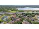 Scenic aerial view of a property near a lake, conveniently located near a highway at 9178 Panzani Pl, Windermere, FL 34786