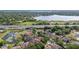 Scenic aerial view of a property near a lake, conveniently located near a highway at 9178 Panzani Pl, Windermere, FL 34786