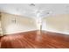 Bright, expansive bedroom with ceiling fan, recessed lighting, hardwood floors, and two windows for plenty of natural light at 9178 Panzani Pl, Windermere, FL 34786