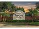 Elegant stone signage welcomes residents to Tuscany Ridge under a beautiful sunset sky at 9178 Panzani Pl, Windermere, FL 34786