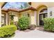 Lush landscaping complements the entryway of this beautiful home at 9178 Panzani Pl, Windermere, FL 34786