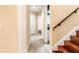 Hallway featuring wood stairs and tiled floors at 9178 Panzani Pl, Windermere, FL 34786