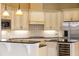 Spacious kitchen with stainless steel appliances, custom cabinets, and granite countertops at 9178 Panzani Pl, Windermere, FL 34786