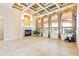 Open-concept living room featuring a fireplace, tile floors, and large windows at 9178 Panzani Pl, Windermere, FL 34786