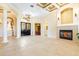 Spacious living area with fireplace, tile flooring, and elegant double-door entry at 9178 Panzani Pl, Windermere, FL 34786