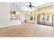 Open-concept living space with tile floors and a seamless transition to the outdoor patio at 9178 Panzani Pl, Windermere, FL 34786
