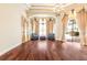 Bright living room featuring hardwood floors, stylish curtains, and comfortable seating at 9178 Panzani Pl, Windermere, FL 34786
