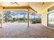 Inviting outdoor living space featuring a stone kitchen area and a screened-in lanai with a pool at 9178 Panzani Pl, Windermere, FL 34786