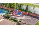 Well-maintained community playground featuring slides and climbing structures near a basketball court at 9178 Panzani Pl, Windermere, FL 34786